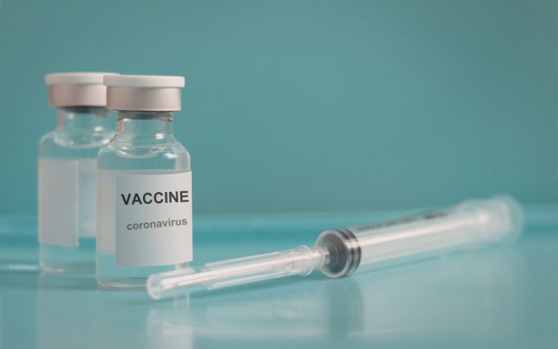 Vaccine vials and syringe